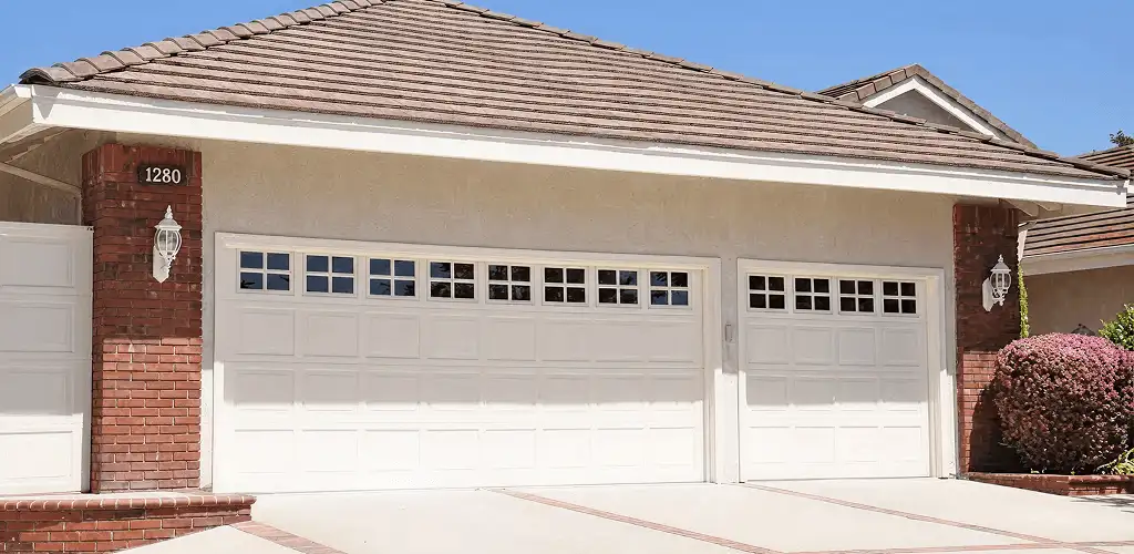 Residential garage door repair service for a double garage door in Rockford, IL