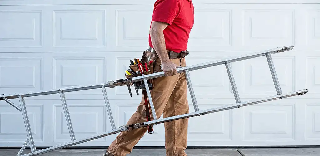Garage door repair technician arriving with tools and ladder in Rockford, IL
