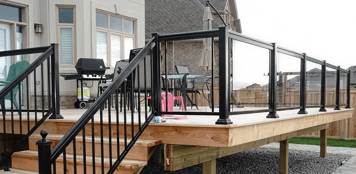 Handrail installation on a deck staircase for safety and code compliance in Rockford, IL