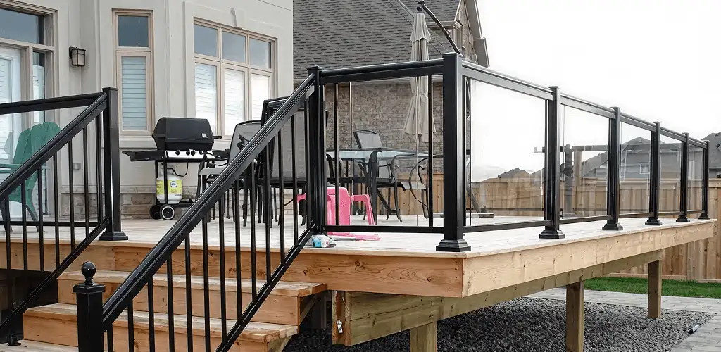 Handrail installation on a deck staircase for safety and code compliance in Rockford, IL